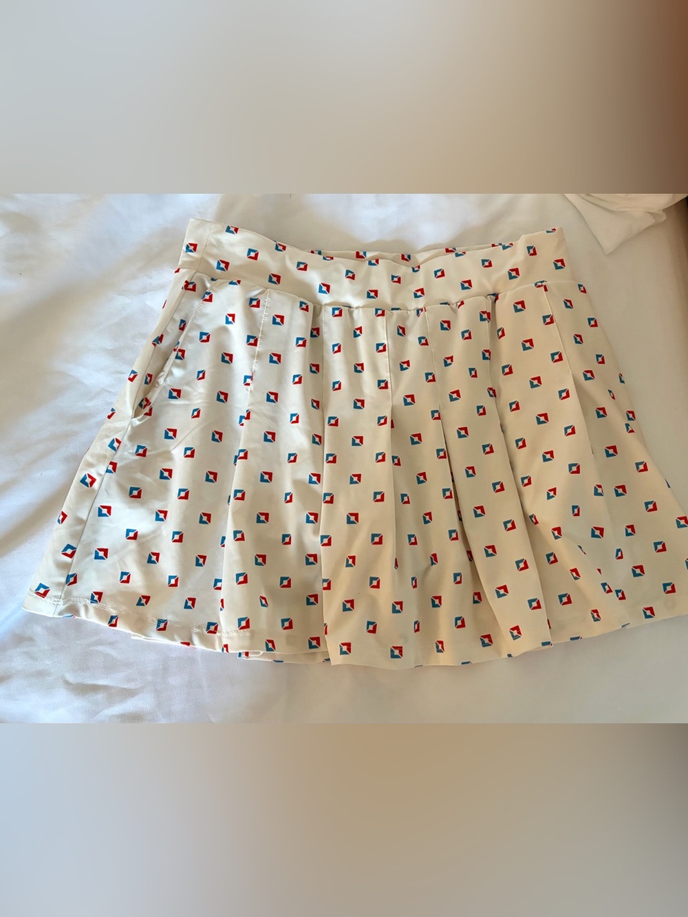 Tory Burch Sport Pleated tennis skort white  with Red & Blue Geo Print
